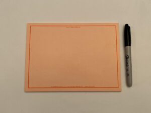 An ORANGE VIS-IT™ Big Idea Pad 8x6 in. (50 sheets) with a pen and a marker next to it.