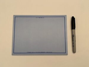 A BLUE VIS-IT™ Big Idea Pad 8x6 in. (50 sheets) with a marker on it.