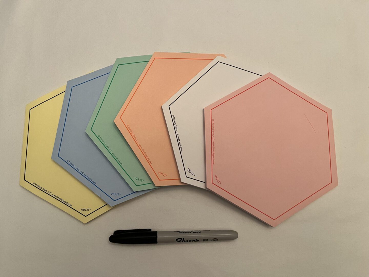 A SIX-COLOR Set of VIS-IT™ Hexagon Pads 6x6 in. (300 sheets total) with a marker.