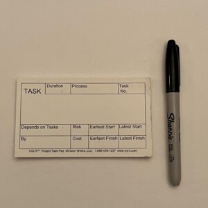 A white VIS-IT™ Small Project Task Pad 5x3 in. (50 sheets) with a pen next to it.