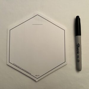 A WHITE VIS-IT™ Hexagon Pad 6x6 in. (50 sheets) with a marker next to it.
